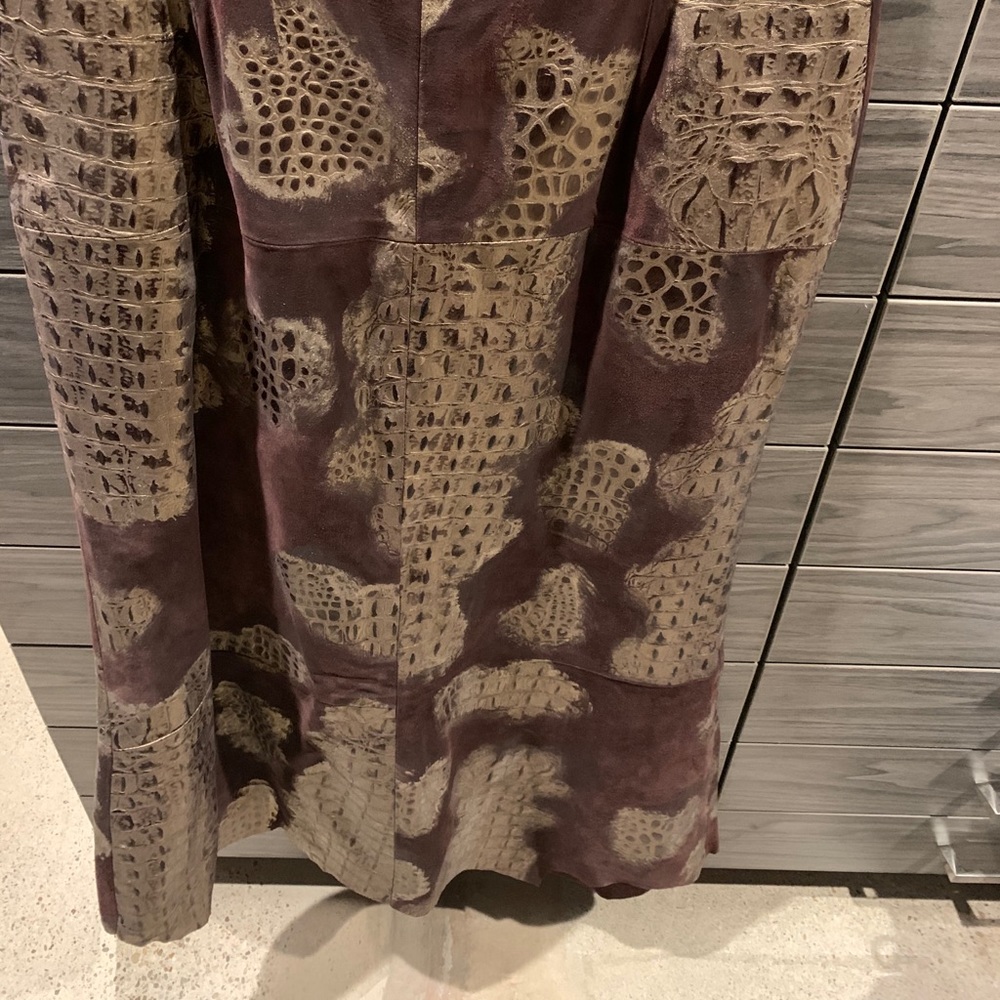 Leather midi skirt with asymmetrical hem